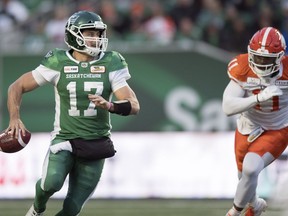 Riders quarterback Zach Collaros (17) is chased by B.C. Lions defensive end Odell Willis (11) on Saturday.