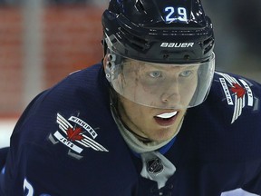 Winnipeg Jets forward Patrik Laine anticipates puck drop against the New Jersey Devils in NHL preseason action in Winnipeg on Thurs., Sept. 27, 2018. Kevin King/Winnipeg Sun/Postmedia Network