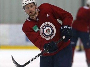 Tucker Poolman works on his shot during Winnipeg Jets practice at Bell MTS Iceplex on Monday.