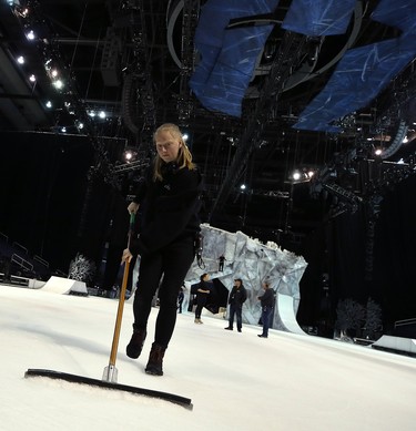 A crew member cleans debris from the ice during rehearsals for Crystal, a Cirque du Soleil production that combines aerial acrobatics with figure skating, at Bell MTS Place in Winnipeg on Wed., Oct. 3, 2018. The show runs from Oct. 3-7. Kevin King/Winnipeg Sun/Postmedia Network