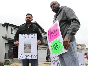 Gurpreet Dhaliwal (left) and Nurudeen Shittu are angry and frustrated after they said they were misled by developers and let down by the City of Winnipeg after finding out a sidewalk would be erected through their front yards well after they bought their homes on El Tassi Drive in Transcona earlier this year. Pair are photographed on Saturday, Oct. 6, 2018. Scott Billeck/Postmedia
