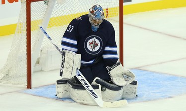 Winnipeg Jets goaltender Connor Hellebuyck makes a save against the Los Angeles Kings in Winnipeg on Tues., Oct. 9, 2018. Kevin King/Winnipeg Sun/Postmedia Network