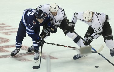 Los Angeles Kings forward Tanner Pearson (centre) keeps Winnipeg Jets forward Nikolaj Ehlers (left) from checking centre Adrian Kempe in Winnipeg on Tues., Oct. 9, 2018. Kevin King/Winnipeg Sun/Postmedia Network