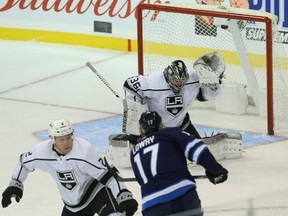 Winnipeg Jets centre Adam Lowry (17) fires a shot high over Los Angeles Kings goaltender Jack Campbell in Winnipeg on Tues., Oct. 9, 2018. Kevin King/Winnipeg Sun/Postmedia Network