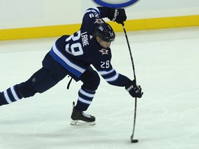 Winnipeg Jets forward Patrik Laine leans into a power-play shot against the Los Angeles Kings in Winnipeg on Tues., Oct. 9, 2018. Kevin King/Winnipeg Sun/Postmedia Network