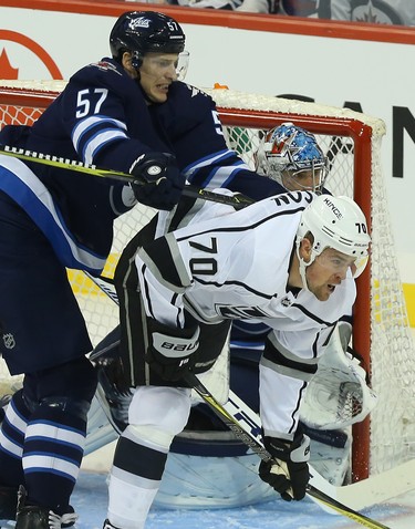 Winnipeg Jets defenceman Tyler Myers (left) cross-checks Los Angeles Kings forward Tanner Pearson in Winnipeg on Tues., Oct. 9, 2018. Kevin King/Winnipeg Sun/Postmedia Network