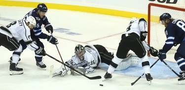 Winnipeg Jets centre Mark Scheifele (left) and forward Kyle Connor (right) can't get to a loose puck in front of Los Angeles Kings goaltender Jack Campbell with Drew Doughty (left) and Adrian Kempe defending in Winnipeg on Tues., Oct. 9, 2018. Kevin King/Winnipeg Sun/Postmedia Network