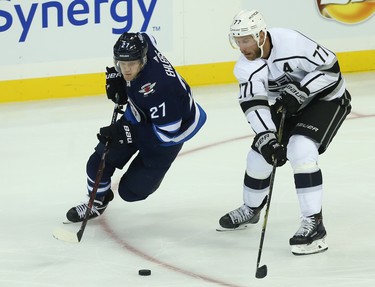 Winnipeg Jets forward Nikolaj Ehlers (left) steals the puck from Los Angeles Kings forward Jeff Carter in Winnipeg on Tues., Oct. 9, 2018. Kevin King/Winnipeg Sun/Postmedia Network