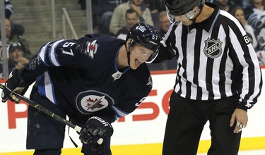 Winnipeg Jets defenceman Tyler Myers reacts after blocking a shot against the Los Angeles Kings in Winnipeg on Tues., Oct. 9, 2018. Kevin King/Winnipeg Sun/Postmedia Network