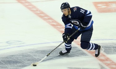 Winnipeg Jets centre Bryan Little carries the puck throughout the neutral zone against the Los Angeles Kings in Winnipeg on Tues., Oct. 9, 2018. Kevin King/Winnipeg Sun/Postmedia Network