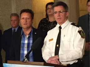 Manitoba Infrastructure Minister Ron Schuler and Winnipeg Police Service Traffic Services Insp. Gord Spado address the media on Tuesday, on changes under The Highway Traffic Act and the Drivers and Vehicles Act that come into force Nov. 1 that will allow for short-term roadside licence suspensions for using a cellphone or other hand-operated electronic devices while driving.