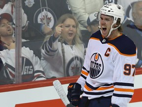 Edmonton Oilers centre Connor McDavid celebrates his third-period goal against the Jets on Tuesday night. (Kevin King/Winnipeg Sun)