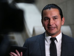 Wab Kinew, leader of the provincial New Democratic Party, speaks with reporters at the Manitoba Legislative Building on Monday, about documents revealing cuts and costs associated with the closing of several emergency rooms in Winnipeg.