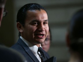 Wab Kinew, leader of the provincial New Democratic Party, speaks with reporters at the Manitoba Legislative Building on Mon., Oct. 29, 2018, about documents revealing cuts and costs associated with the closing of several emergency rooms in Winnipeg. Kevin King/Winnipeg Sun/Postmedia Network