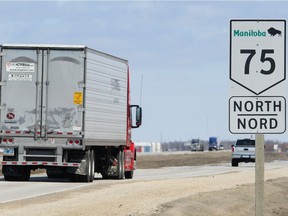 Traffic moves along Highway 75 south of Winnipeg, Man. Monday April 22, 2013. The Manitoba Trucking Association says that if Highway 75 is closed due to a potential flood, the additional transportation charges for goods will be passed along to consumers.