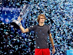 Alexander Zverev of Germany celebrates victory with the trophy following the singles final against Novak Djokovic of Serbia during Day Eight of the Nitto ATP Finals at The O2 Arena on November 18, 2018 in London. (Clive Brunskill/Getty Images)