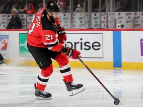 NEWARK, NEW JERSEY - NOVEMBER 21:   Kyle Palmieri #21 of the New Jersey Devils takes the puck in the second period against the Montreal Canadiens at Prudential Center on November 21, 2018 in Newark, New Jersey. (Photo by Elsa/Getty Images)
