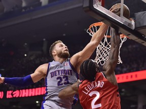 Detroit Pistons forward Blake Griffin rejects Toronto Raptors forward Kawhi Leonard during Wednesday's game. (THE CANADIAN PRESS)