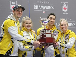 Manitoba skip Colin Kurz (from left), third Megan Walter, second Brendan Bilawka and lead Sara Oliver pose with the trophy after winning the 2019 Canadian Mixed Curling Championship at the Fort Rouge Curling Club in Winnipeg on Saturday. Manitoba beat Nova Scotia 7-4 to capture its first national title since 2009.