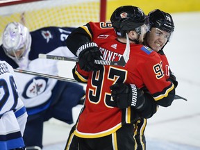 Calgary Flames' Sam Bennett celebrates his goal with teammate Matthew Tkachuk during Wednesday's win over the Winnipeg Jets. (THE CANADIAN PRESS)