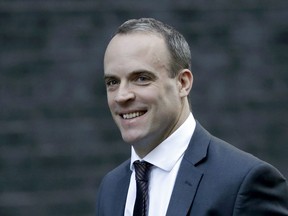 Britain's Secretary of State for Exiting the European Union Dominic Raab arrives for a cabinet meeting at 10 Downing Street in London, Tuesday, Nov. 13, 2018.