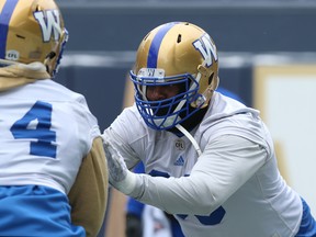 Things may escalate during today’s Bombers-Riders tilt. Winnipeg offensive lineman Stanley Bryant (right) says of the Riders’ defence: “We know what their defence brings and we’re gonna bring that same nastiness to the game.” Kevin King/Winnipeg Sun