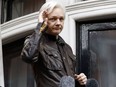 In this May 19, 2017, file photo, WikiLeaks founder Julian Assange greets supporters from a balcony of the Ecuadorian embassy in London.