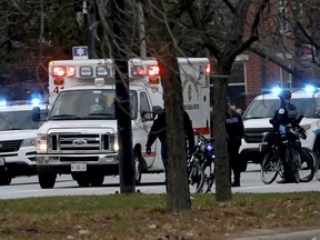 An ambulance believed to be carrying an injured Chicago police officer departs Mercy Hospital Monday, Nov. 19, 2018, in Chicago. (Zbigniew Bzdak/Chicago Tribune via AP)
