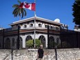 A man walks beside Canada's embassy in Havana, Cuba, Tuesday, April 17, 2018.