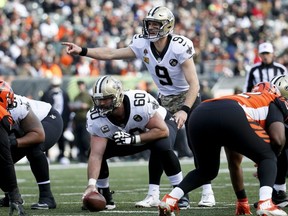 Saints quarterback Drew Brees (9) directs his players before the snap during first half NFL action against the Bengals, Sunday, Nov. 11, 2018, in Cincinnati.