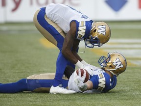 Winnipeg Blue Bombers Corey Washington (6) and quarterback Chris Streveler (17) celebrate a touchdown against the Edmonton Eskimos during second half CFL action in Edmonton on Saturday.