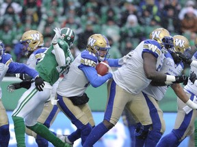 Winnipeg Blue Bombers quarterback Matt Nichols looks for an opening against the Saskatchewan Roughriders during first half CFL West Division semifinal action in Regina on Sunday.