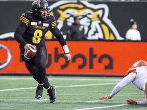 Hamilton Tiger-Cats quarterback Jeremiah Masoli (8) scrambles against the B.C. Lions during first half CFL Football division semifinal game action in Hamilton, Ont. on Sunday, November 11, 2018.