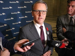 Health Minister Cameron Friesen speaks with media on Monday at the Manitoba Legislature.