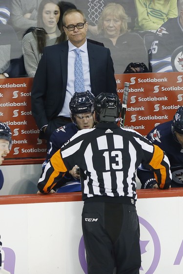 Winnipeg Jets head coach Paul Maurice talks to referee during the first period NHL action against Chicago Blackhawks in Winnipeg on Thursday, November 29, 2018. THE CANADIAN PRESS/John Woods