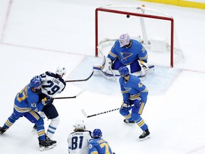 Winnipeg Jets' Patrik Laine (29) scores one of his five goals against the St. Louis Blues on Saturday night.