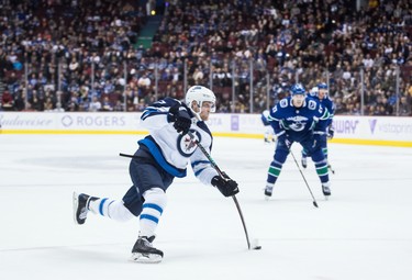 Winnipeg Jets' Nikolaj Ehlers, of Denmark, takes a shot on goal during the first period of an NHL hockey game against the Vancouver Canucks in Vancouver, on Monday November 19, 2018. THE CANADIAN PRESS/Darryl Dyck