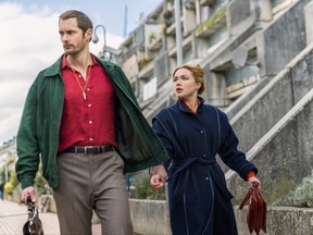 This image released by AMC shows Alexander Skarsgard, left, and Florence Pugh in a scene from the series "The Little Drummer Girl," premiering on Nov. 19. (Jonathan Olley/AMC/Ink Factory via AP)