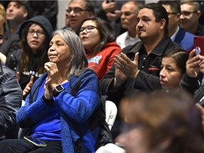 Lubicon Lake Band community members participate in a celebration to commemorate the signing of a historic land claim settlement with government and band council officials in the school gym at Little Buffalo, Alta., on Tuesday, Nov. 13, 2018.