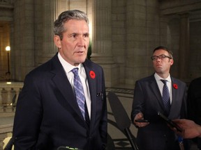 Premier Brian Pallister speaks with reporters on Tuesday.
