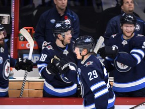 Patrik Laine of Winnipeg Jets celebrates team's second goal with teammates during the NHL Global Series Challenge game against the Florida Panthers Friday, in Helsinki, Finland.