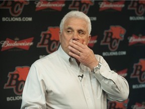 Pictured is coach Wally Buono speaking to the media.