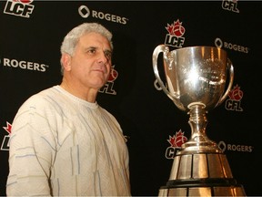 Wally Buono with the Grey Cup in 2006, when his B.C. Lions won the fourth of his five CFL championships. Buono won three Grey Cups in Calgary (1992, 1998 and 2001) in addition to his two Cup titles in B.C. (2006 and 2011).