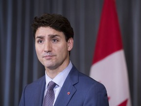 Prime Minister Justin Trudeau talks to journalists during a press conference after the 33rd ASEAN Summit in Singapore, Thursday, Nov. 15, 2018. (AP Photo/Bernat Armangue)