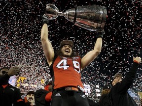 Alex Singleton (49) is one of four members of the Grey Cup-champion Calgary Stampeders who have been released from their CFL contracts to sign NFL deals.