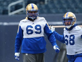Blue Bombers’ Sukh Chungh (left) and Geoff Gray work out during a recent practice. Chungh, Pat Neufeld and Jackson Jeffcoat have all received fines due to illegal hits and coach Mike O’Shea knows his team needs to be “smarter.” (KEVIN KING/WINNIPEG SUN FILE)