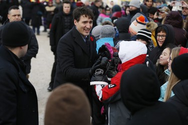 Prime Minister Justin Trudeau greets a crowd after announcing the opening of the repaired railway in Churchill, Manitoba Thursday, November 1, 2018. Prime Minister Justin Trudeau visited Churchill today to announce the opening of the railway and the Port of Churchill. THE CANADIAN PRESS/John Woods