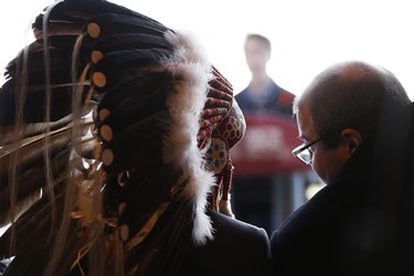 Manitoba Grand Chief Arland Dumas and Murad Al-Katib, President of Arctic Gateway speak to each other as Prime Minister Justin Trudeau announces the opening of the repaired railway in Churchill, Manitoba Thursday, November 1, 2018. Prime Minister Justin Trudeau visited Churchill today to announce the opening of the railway and the Port of Churchill. THE CANADIAN PRESS/John Woods