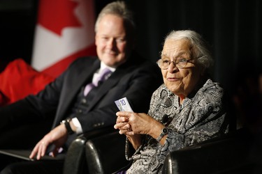 Clutching some $10 banknotes Wanda Robson, Viola Desmond's sister, speaks at a launch of Canada's new $10 banknote, which has a portrait of Desmond, the first Canadian woman on a banknote, at the Canadian Museum For Human Rights in Winnipeg, Monday, Nov. 19, 2018. Bank of Canada Governor Stephen Poloz and Robson, officially launched the unique, vertically oriented purple bill. THE CANADIAN PRESS/John Woods