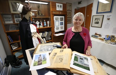 Dr. Barbara Paterson, chair of a committee which oversees the Misericordia Heritage Collection, poses with pictures and artifacts of war hero Agnes Wilkie of Carman, Man., the only nurse killed by enemy action in the Second World War, at the Misericordia Education & Research Centre in Winnipeg, on Wed., Nov. 7, 2018. Kevin King/Winnipeg Sun/Postmedia Network